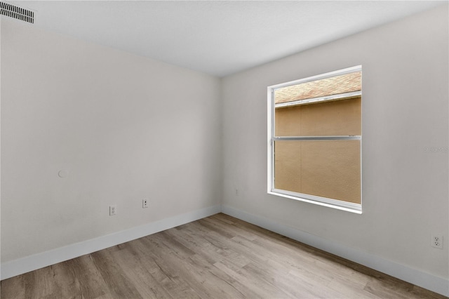 12917 Grovehurst Ave, Winter Garden, FL 34787 - unfurnished room with wood finished floors and baseboards