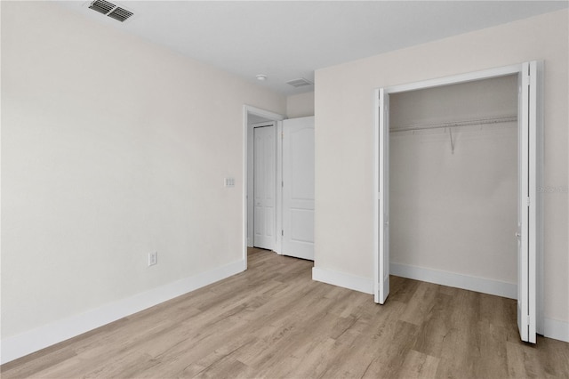 12917 Grovehurst Ave, Winter Garden, FL 34787 - unfurnished bedroom featuring light wood finished floors, baseboards, and a closet