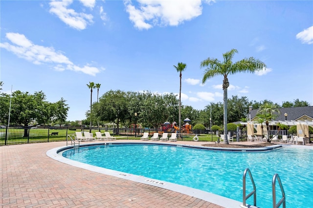 12917 Grovehurst Ave, Winter Garden, FL 34787 - community pool featuring fence and a patio