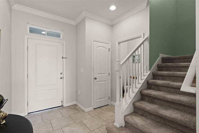 1553 Caterpillar St, Saint Cloud, FL 34771 - foyer with crown molding, stairway, baseboards, light tile patterned floors, and recessed lighting