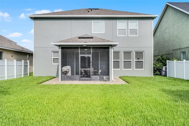 1553 Caterpillar St, Saint Cloud, FL 34771 - back of house featuring a sunroom, stucco siding, and roof with shingles