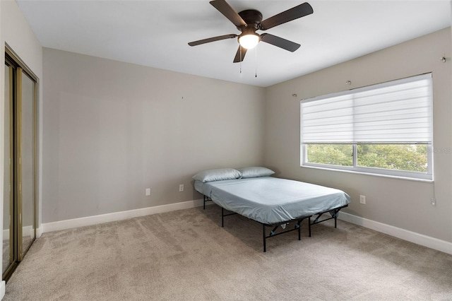 1140 S Orlando Ave Unit E11, Maitland, FL 32751 - bedroom featuring light carpet, baseboards, a closet, and ceiling fan
