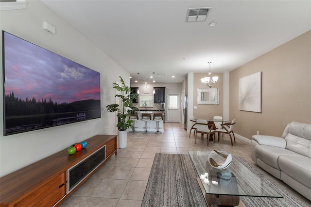 11631 Mystery Ln, Orlando, FL 32832 - living room featuring light tile patterned flooring, a chandelier, recessed lighting, and baseboards