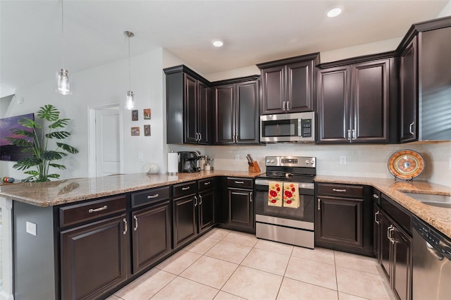 11631 Mystery Ln, Orlando, FL 32832 - kitchen featuring stainless steel appliances, light tile patterned flooring, light stone countertops, and backsplash