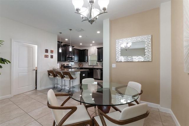 11631 Mystery Ln, Orlando, FL 32832 - dining room featuring light tile patterned flooring, a chandelier, baseboards, and recessed lighting