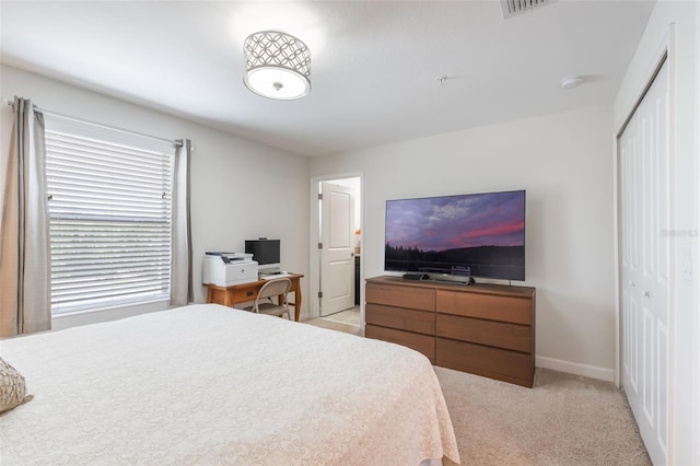 11631 Mystery Ln, Orlando, FL 32832 - bedroom featuring a closet, light carpet, and baseboards