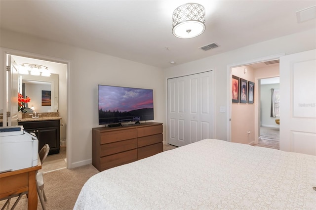 11631 Mystery Ln, Orlando, FL 32832 - bedroom featuring light colored carpet, baseboards, a closet, and ensuite bathroom