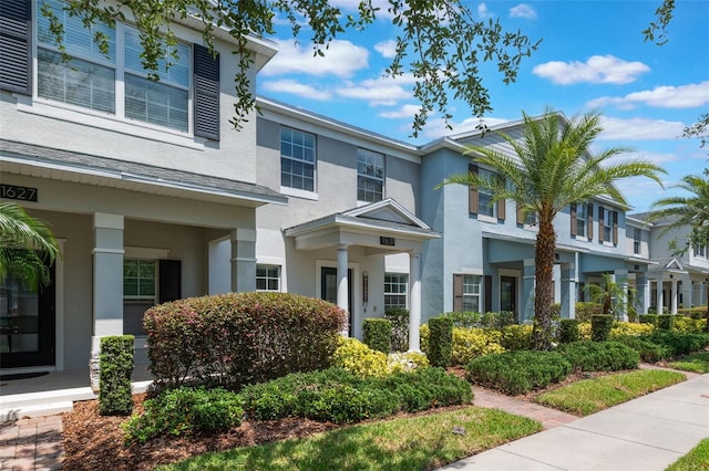 11631 Mystery Ln, Orlando, FL 32832 - view of front of house with stucco siding