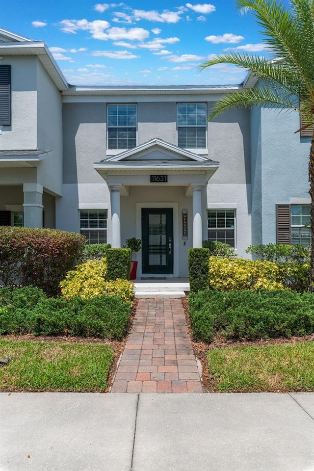 11631 Mystery Ln, Orlando, FL 32832 - property entrance featuring stucco siding