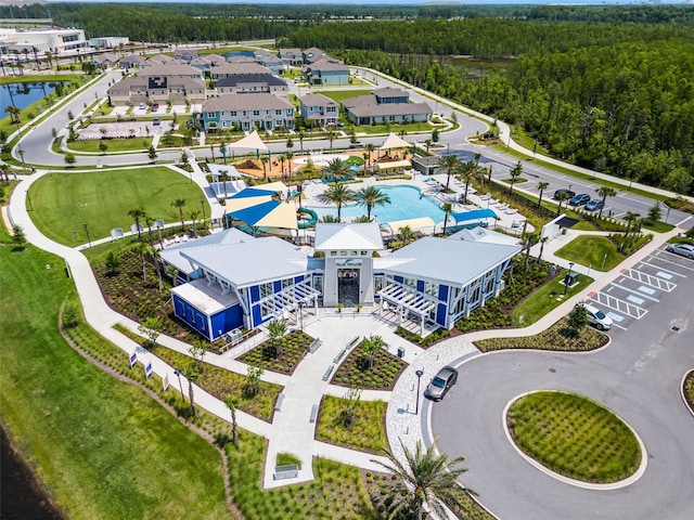 11631 Mystery Ln, Orlando, FL 32832 - bird's eye view of a pool, a forest, and a large body of water