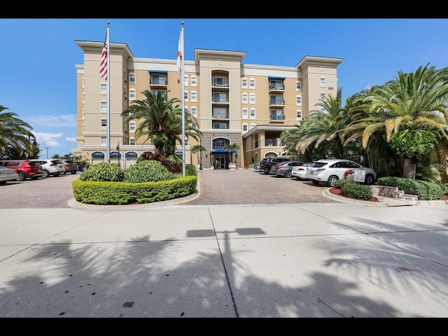 1064 N Tamiami Trl Unit 1219, Sarasota, FL 34236 - view of building exterior featuring uncovered parking
