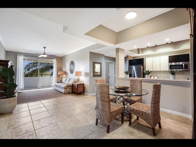 1064 N Tamiami Trl Unit 1219, Sarasota, FL 34236 - dining space featuring light tile patterned flooring and baseboards