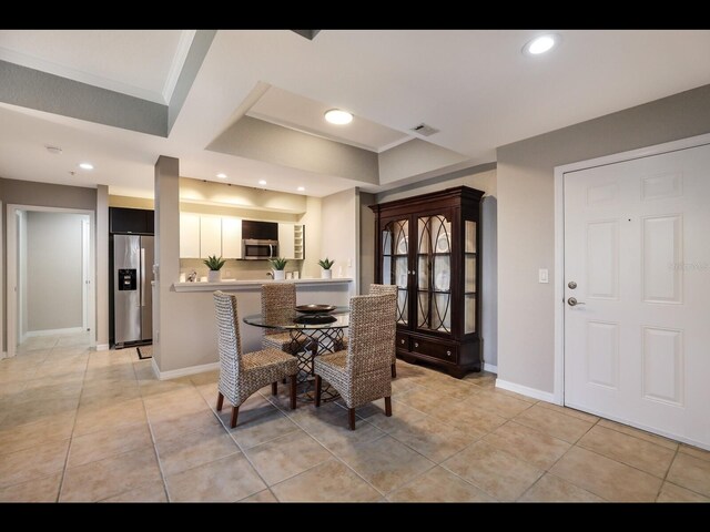 1064 N Tamiami Trl Unit 1219, Sarasota, FL 34236 - dining room featuring baseboards, light tile patterned flooring, recessed lighting, and ornamental molding