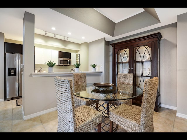 1064 N Tamiami Trl Unit 1219, Sarasota, FL 34236 - dining space with baseboards, light tile patterned flooring, and recessed lighting