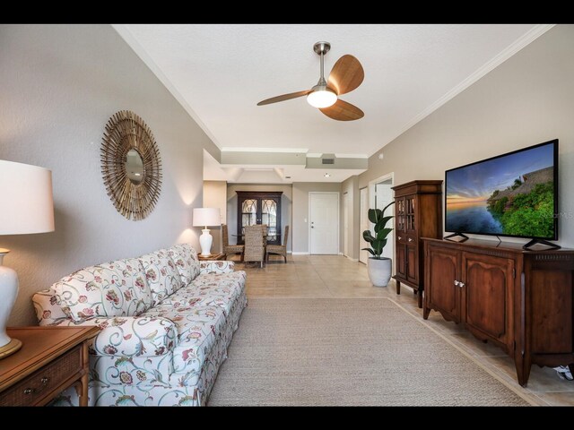 1064 N Tamiami Trl Unit 1219, Sarasota, FL 34236 - living room featuring a ceiling fan, light tile patterned floors, crown molding, and baseboards