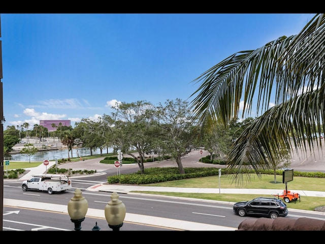1064 N Tamiami Trl Unit 1219, Sarasota, FL 34236 - view of asphalt street with traffic signs, sidewalks, a water view, and curbs