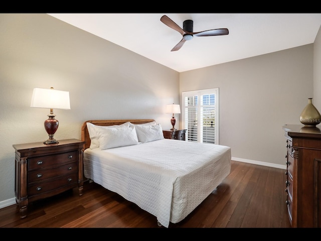 1064 N Tamiami Trl Unit 1219, Sarasota, FL 34236 - bedroom featuring dark wood-style floors, baseboards, and ceiling fan