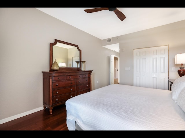 1064 N Tamiami Trl Unit 1219, Sarasota, FL 34236 - bedroom with dark wood-style flooring, baseboards, a closet, and ceiling fan