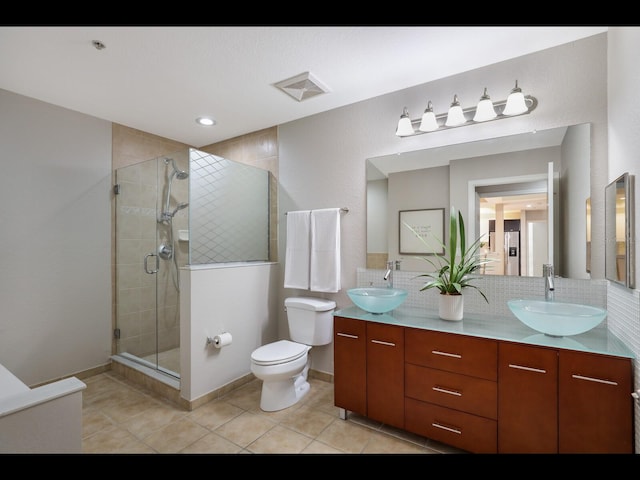 1064 N Tamiami Trl Unit 1219, Sarasota, FL 34236 - full bath with a stall shower, tile patterned flooring, toilet, double vanity, and baseboards