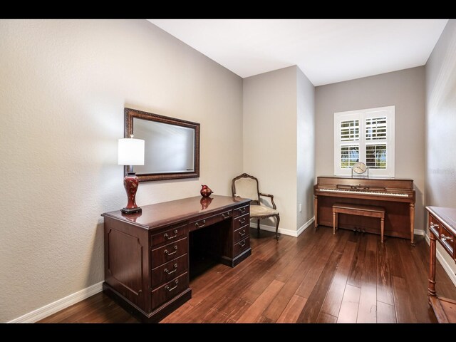 1064 N Tamiami Trl Unit 1219, Sarasota, FL 34236 - office area featuring dark wood-type flooring and baseboards