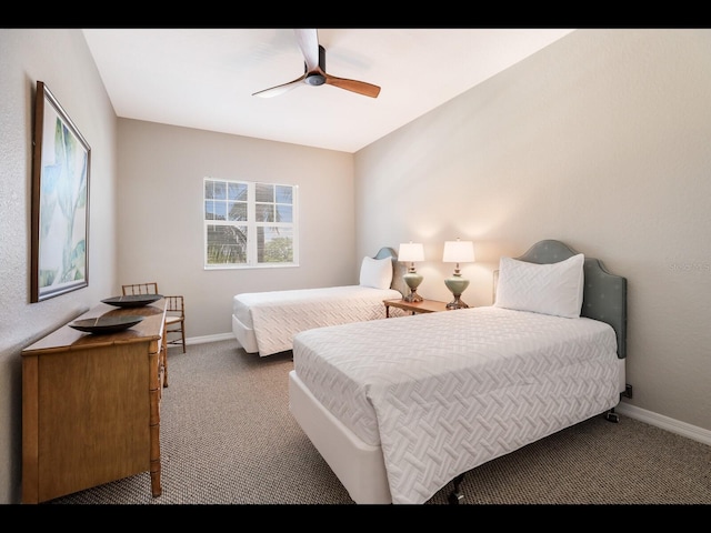 1064 N Tamiami Trl Unit 1219, Sarasota, FL 34236 - carpeted bedroom with baseboards and ceiling fan