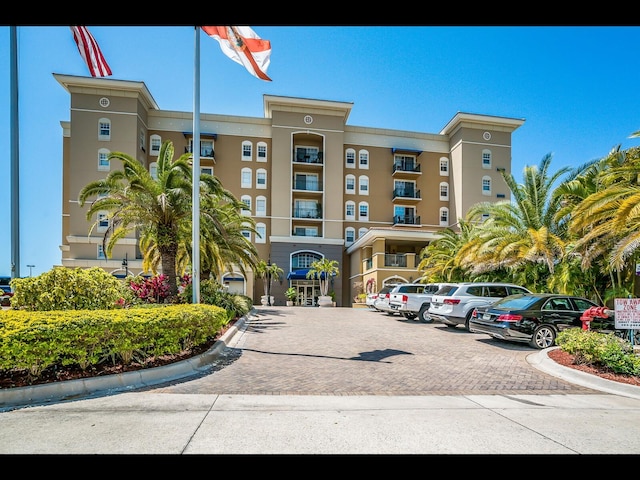 1064 N Tamiami Trl Unit 1219, Sarasota, FL 34236 - view of apartment building / complex with uncovered parking