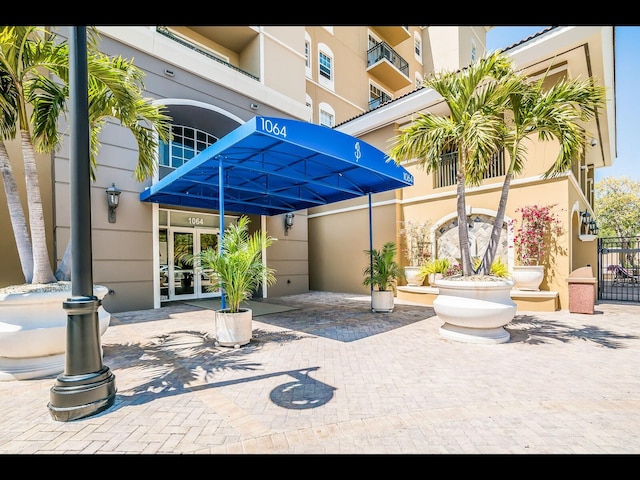 1064 N Tamiami Trl Unit 1219, Sarasota, FL 34236 - exterior space with french doors and stucco siding
