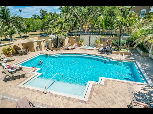 1064 N Tamiami Trl Unit 1219, Sarasota, FL 34236 - community pool with a patio and fence