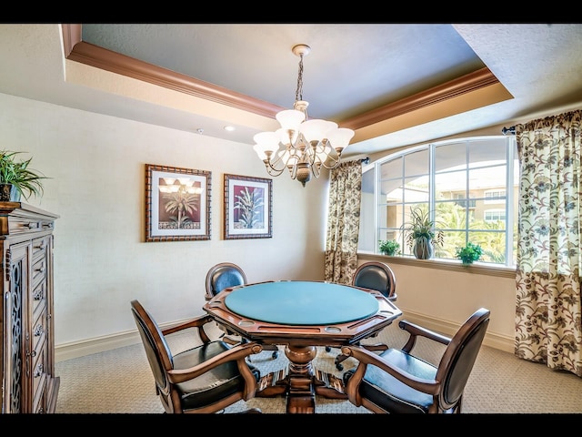 1064 N Tamiami Trl Unit 1219, Sarasota, FL 34236 - carpeted dining space featuring a raised ceiling, a chandelier, baseboards, and crown molding
