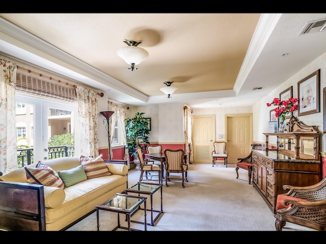 1064 N Tamiami Trl Unit 1219, Sarasota, FL 34236 - sitting room featuring light carpet and a tray ceiling