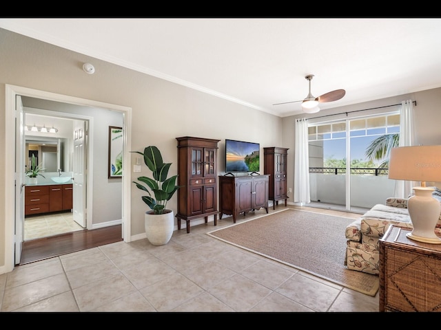 1064 N Tamiami Trl Unit 1219, Sarasota, FL 34236 - living area featuring ornamental molding, a ceiling fan, light tile patterned floors, and baseboards