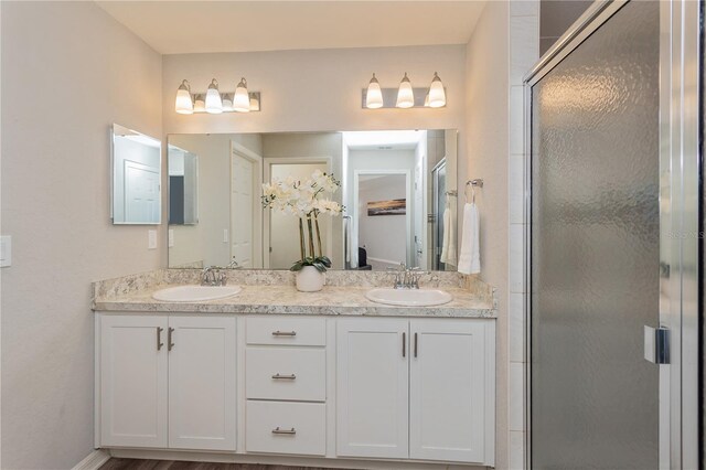 871 Orleans Dr, Eagle Lake, FL 33839 - bathroom with a shower stall, double vanity, and a spacious closet