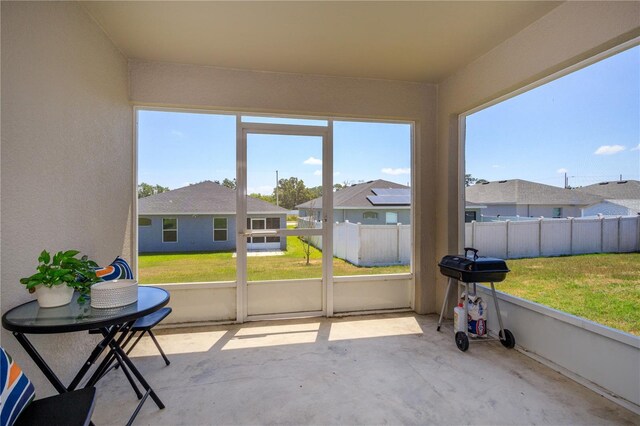 871 Orleans Dr, Eagle Lake, FL 33839 - sunroom with healthy amount of natural light and a residential view