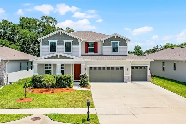 10249 Spring Lake Dr, Clermont, FL 34711 - craftsman inspired home featuring a front yard, concrete driveway, roof with shingles, and a garage