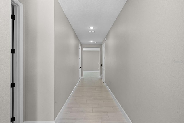 10249 Spring Lake Dr, Clermont, FL 34711 - hallway featuring baseboards and recessed lighting