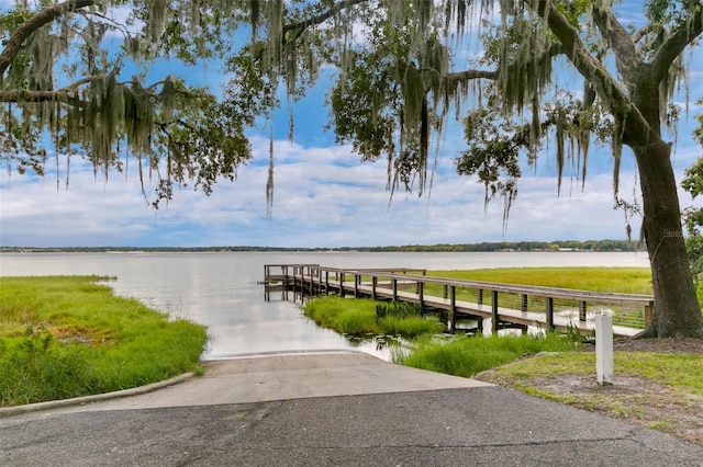10249 Spring Lake Dr, Clermont, FL 34711 - dock with a boat ramp and a water view