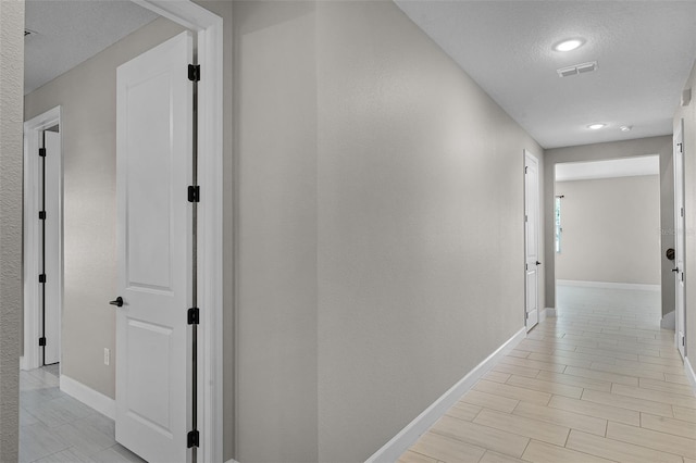 10249 Spring Lake Dr, Clermont, FL 34711 - hall featuring baseboards and a textured ceiling