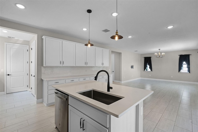 10249 Spring Lake Dr, Clermont, FL 34711 - kitchen featuring dishwasher, a chandelier, tasteful backsplash, light countertops, and recessed lighting