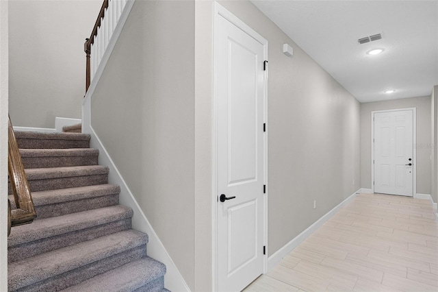10249 Spring Lake Dr, Clermont, FL 34711 - stairway with baseboards and recessed lighting
