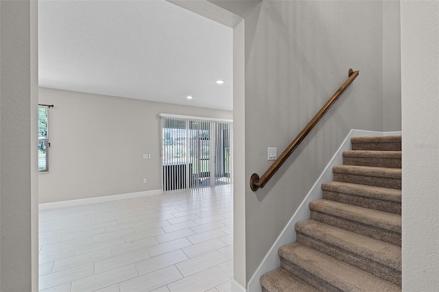 10249 Spring Lake Dr, Clermont, FL 34711 - staircase featuring recessed lighting and tile patterned flooring