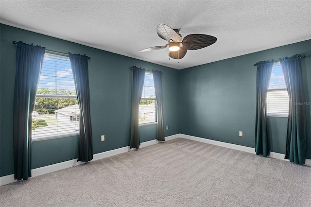 10249 Spring Lake Dr, Clermont, FL 34711 - empty room featuring ceiling fan, a textured ceiling, plenty of natural light, and light carpet
