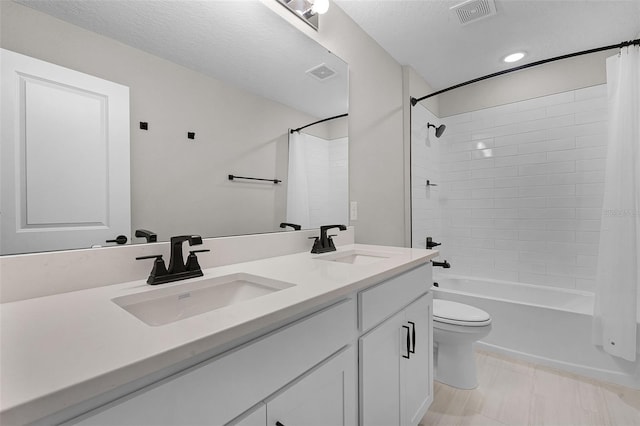 10249 Spring Lake Dr, Clermont, FL 34711 - bathroom featuring double vanity, shower / tub combo, and recessed lighting