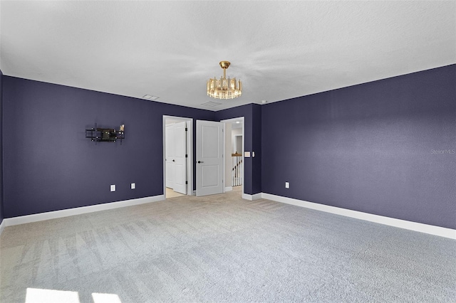10249 Spring Lake Dr, Clermont, FL 34711 - unfurnished bedroom featuring a chandelier and carpet floors