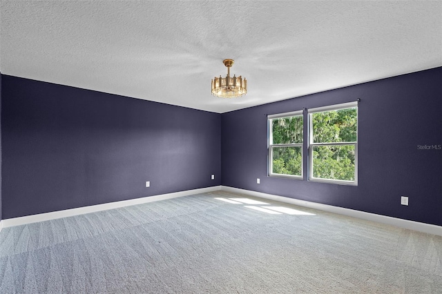 10249 Spring Lake Dr, Clermont, FL 34711 - empty room featuring a chandelier, carpet, and a textured ceiling
