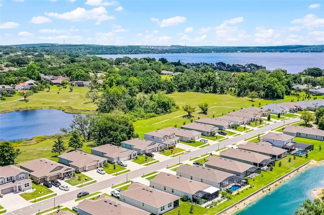 10249 Spring Lake Dr, Clermont, FL 34711 - aerial perspective of suburban area with a large body of water and a tree filled landscape