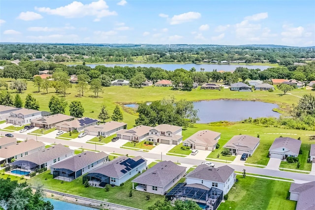10249 Spring Lake Dr, Clermont, FL 34711 - aerial view of residential area with a large body of water and a tree filled landscape