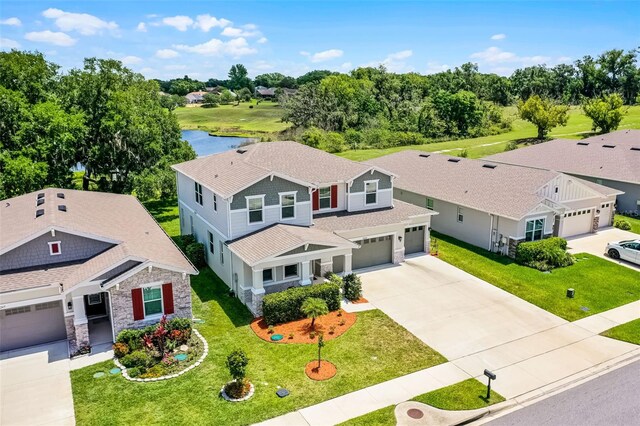 10249 Spring Lake Dr, Clermont, FL 34711 - aerial view of property and surrounding area featuring a tree filled landscape and a nearby body of water