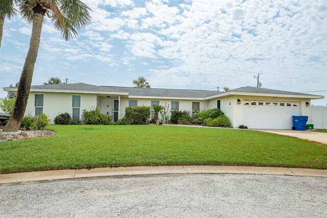 2 Pirates Cv, Ormond Beach, FL 32176 - single story home featuring an attached garage, stucco siding, concrete driveway, and a front lawn