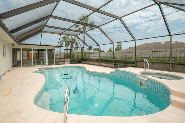 2 Pirates Cv, Ormond Beach, FL 32176 - view of pool featuring a patio area, a pool with connected hot tub, and fence