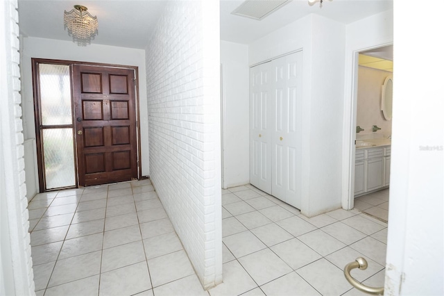 2 Pirates Cv, Ormond Beach, FL 32176 - entryway with light tile patterned floors and wallpapered walls